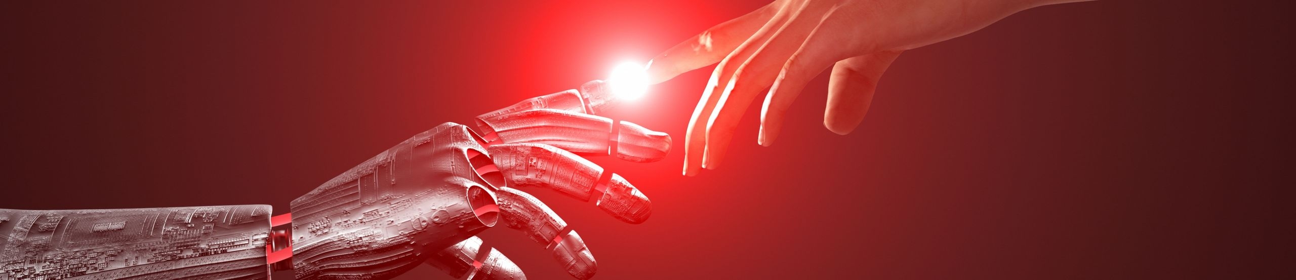 Eine humanoide Roboterhand und eine menschliche Hand berühren sich mit den Zeigefingern.