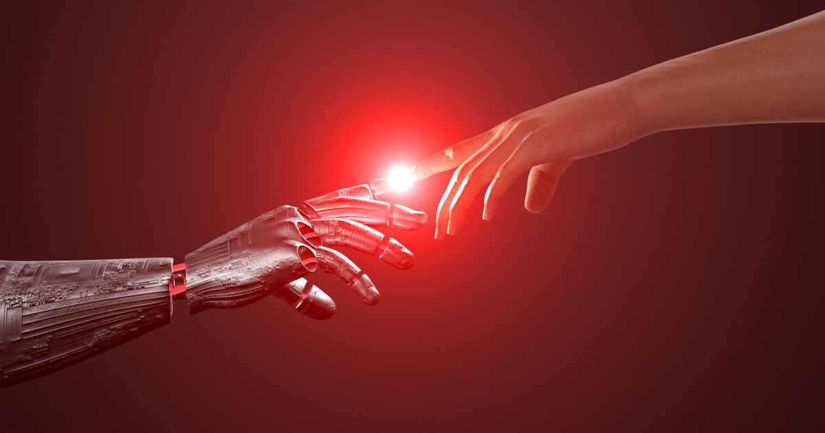 Eine humanoide Roboterhand und eine menschliche Hand berühren sich mit den Zeigefingern.