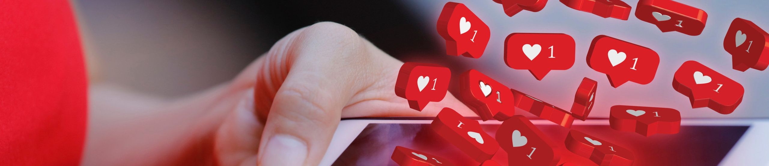 Eine junge Frau schaut auf ihr Smartphone aus dem Instagram-Herzen-Symbole hervorquellen.
